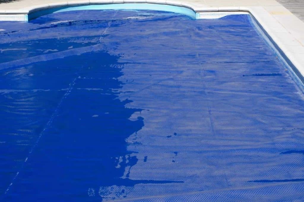 pool with solar pool cover