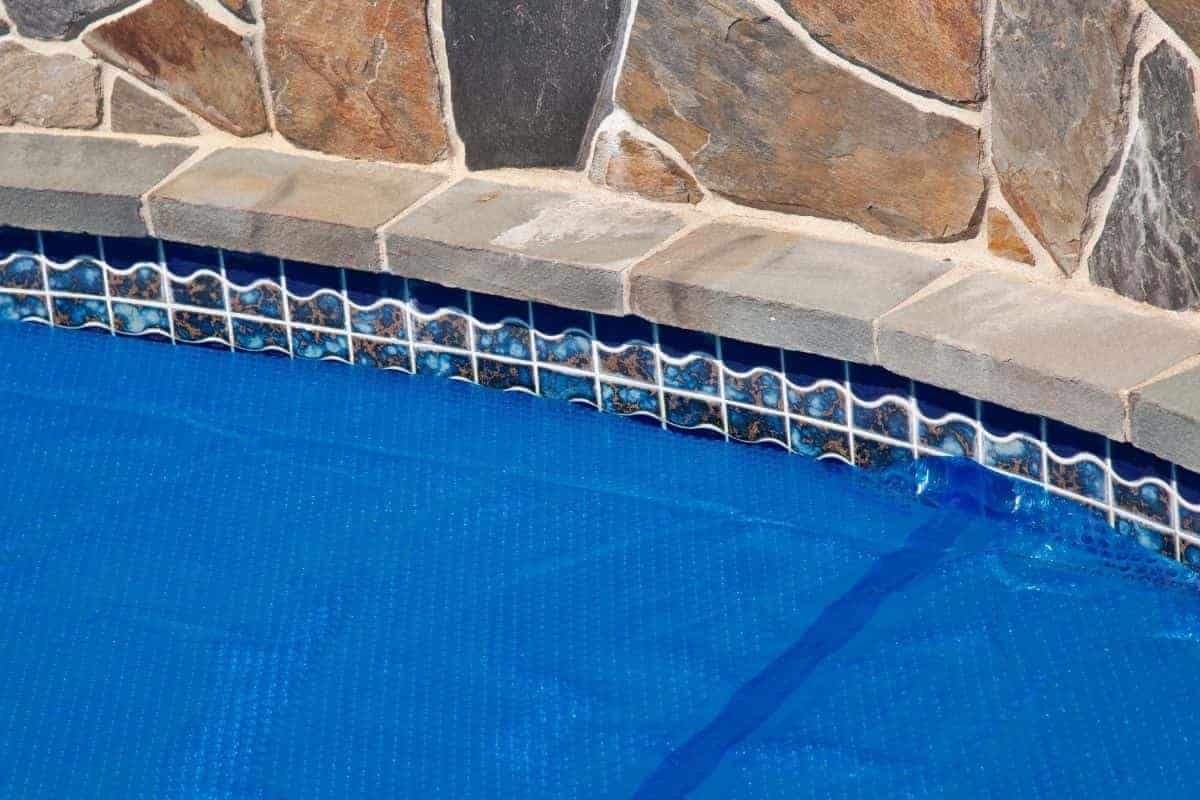 pool with solar pool cover