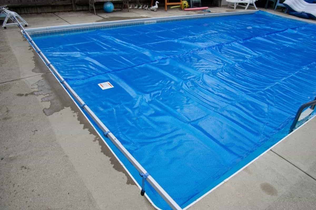 pool with solar pool cover and reel
