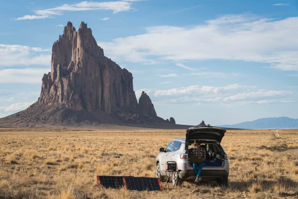 jackery power station beside a car