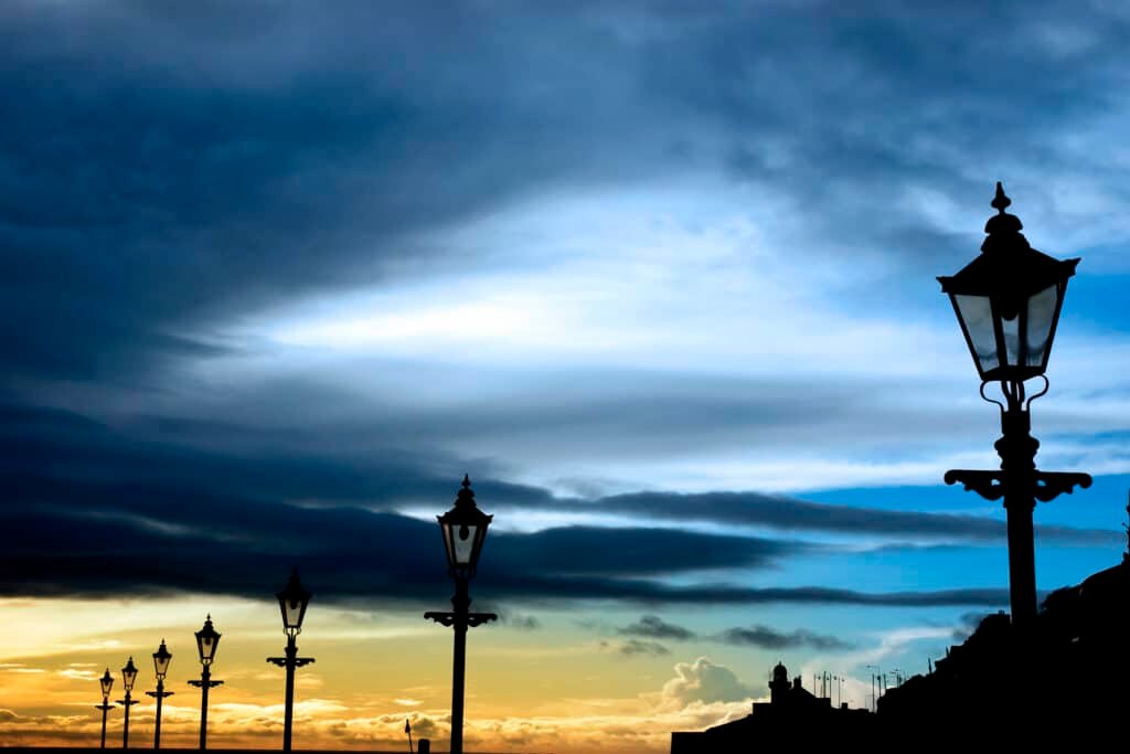 row of vintage lamps and lighthouse