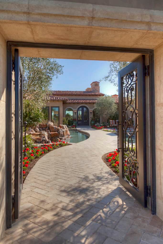 Open gate with path leading to front door