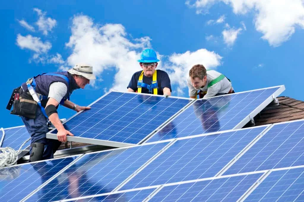 man installing solar panels