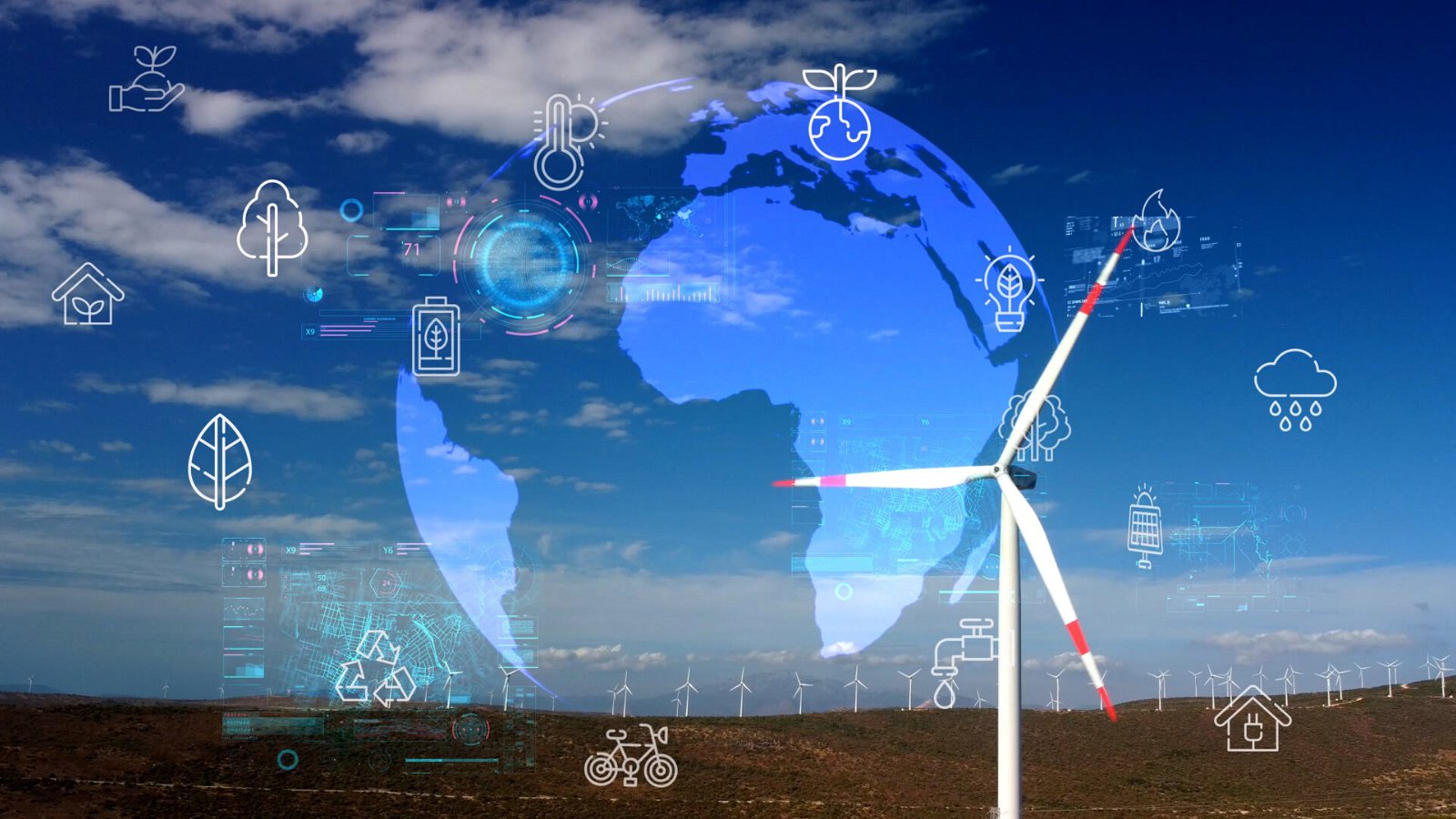 Aerial view over the farm landscape and wind turbines generating clean renewable energy. Renewable energy production for the green ecological world.