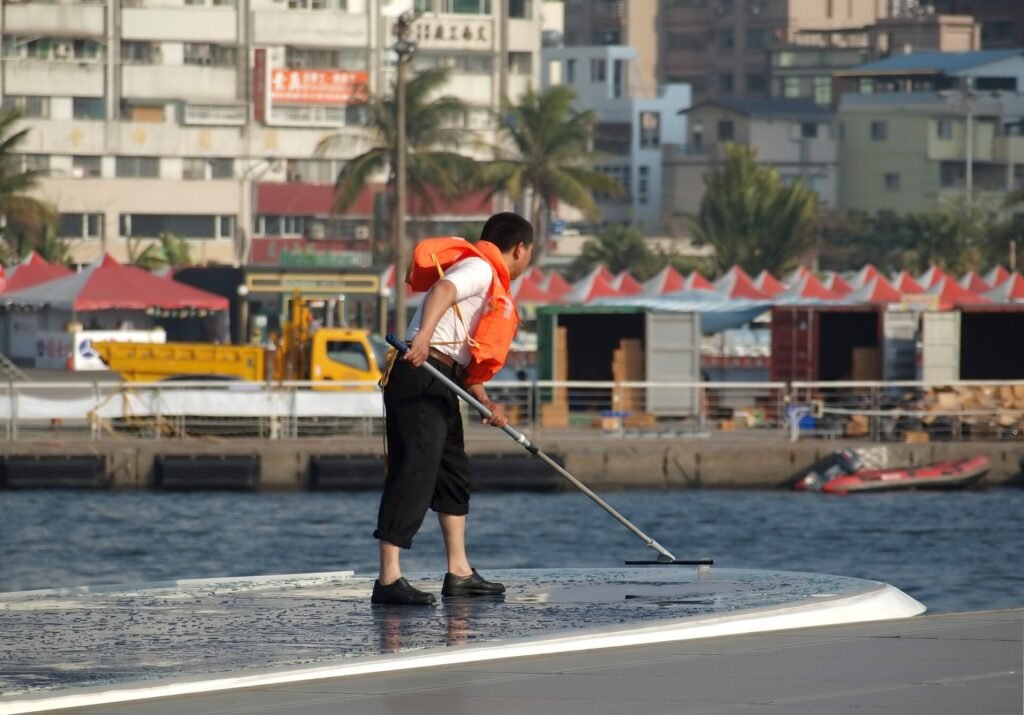 Man cleaning solar panels