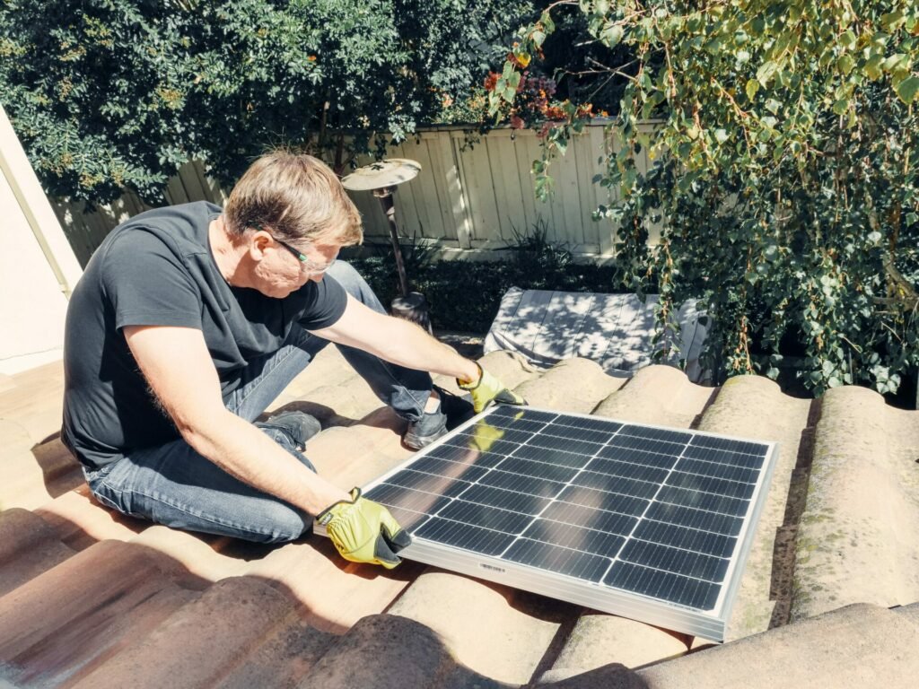 man installing III-V solar panels